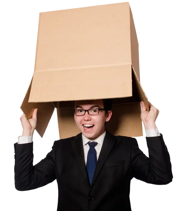 Man in a suit smiling while putting a cardboard box over his head