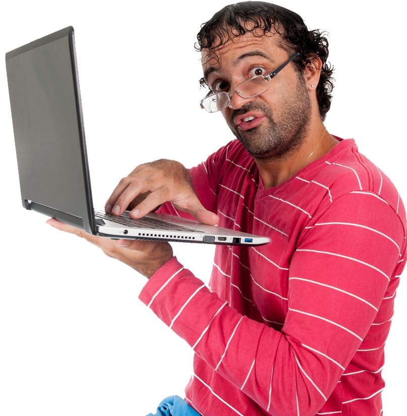 A nerd posing with a laptop in his hands