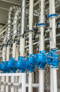 An array of water pumps installed at a commercial building in the USA