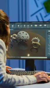A woman creating 3D models on a computer at her office in the USA